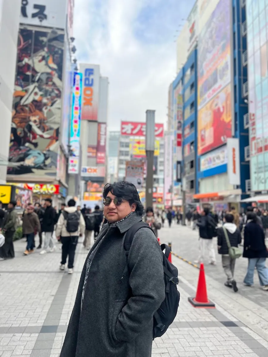 Chanales Flores standing in Akihabara, Tokyo